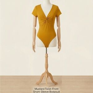 Derek Heart Mustard Twist-Front Short-Sleeve Bodysuit